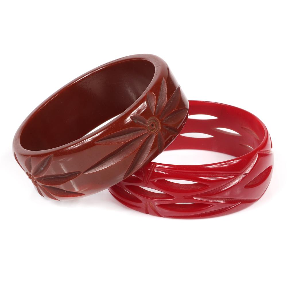 Appraisal: TWO VINTAGE BAKELITE WIDE BANGLE BRACELETS RED WITH PIERCE CARVED