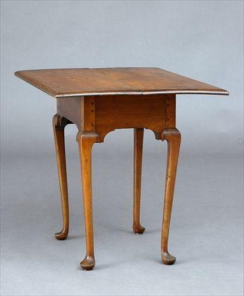 Appraisal: QUEEN ANNE CHERRY TAVERN TABLE The overhanging molded rectangular top