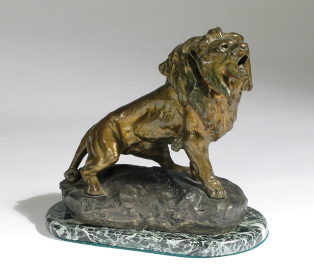 Appraisal: THOMAS FRANCOIS CARTIER BRONZE LION standing on bronze rock outcropping