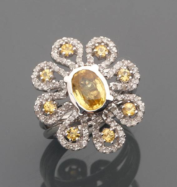 Appraisal: A yellow sapphire diamond and k white gold flower ring