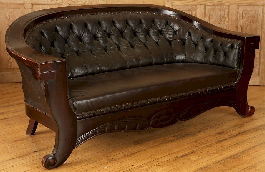 Appraisal: AMERICAN CLASSICAL LEATHER ARCHED BACK SOFA An American Classical brown