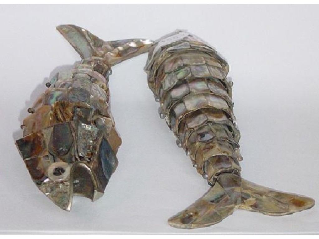 Appraisal: A pair of articulated fish with mother of pearl decoration