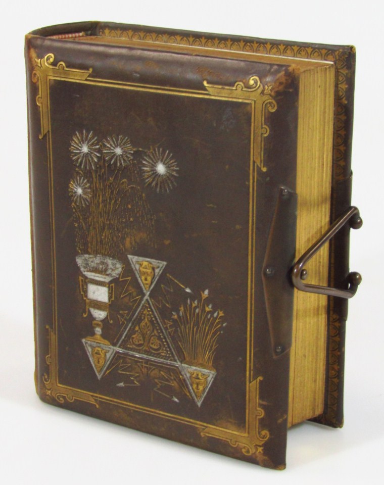 Appraisal: A late Victorian photograph album partially stencilled with gilt highlights