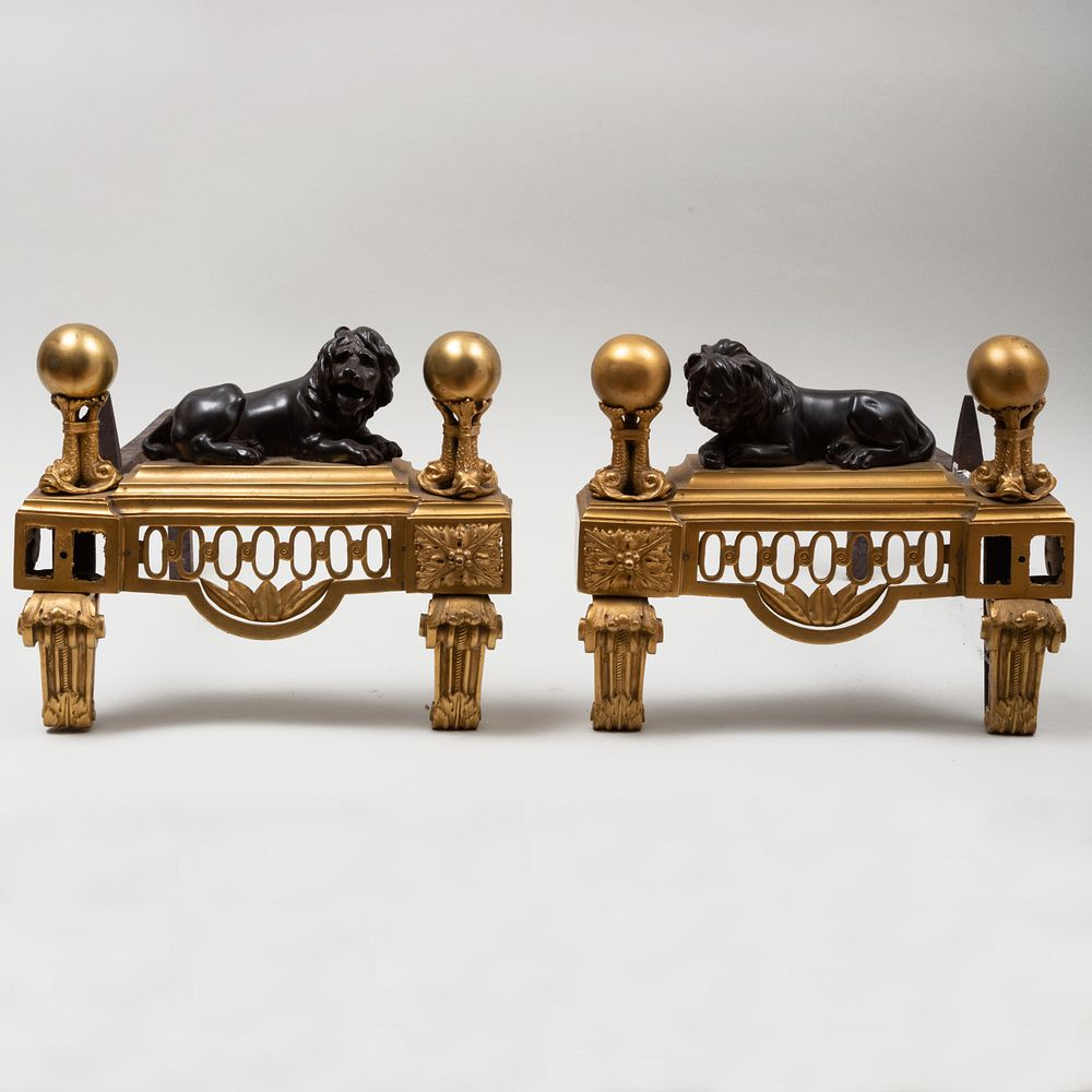 Appraisal: Pair of Regency Empire Bronze and Parcel-Gilt Andirons with Lions