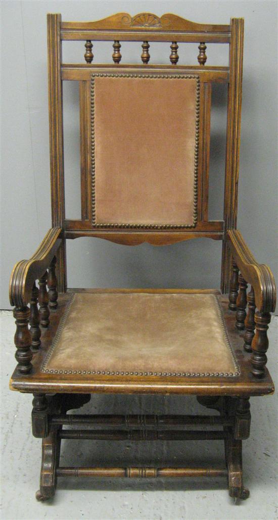 Appraisal: Late th century American rocking chair with stained walnut frame