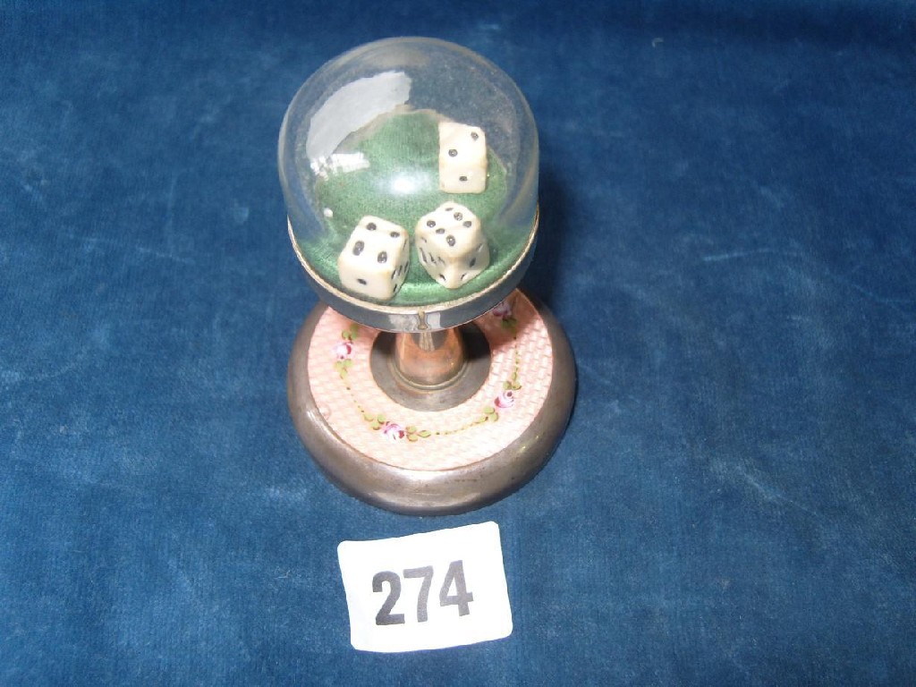 Appraisal: A German dice shaker with spring loaded top and pink