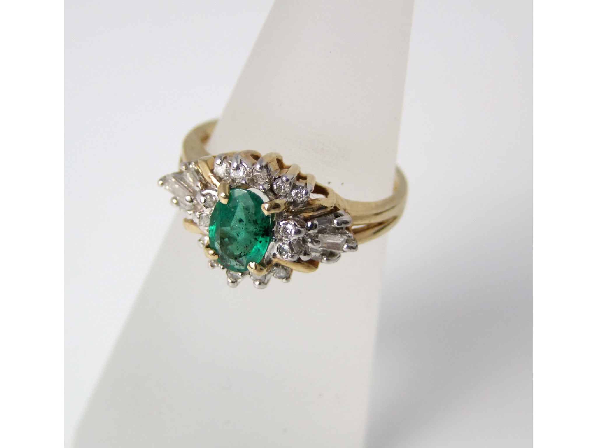 Appraisal: A ct gold emerald and diamond mounted ring size M