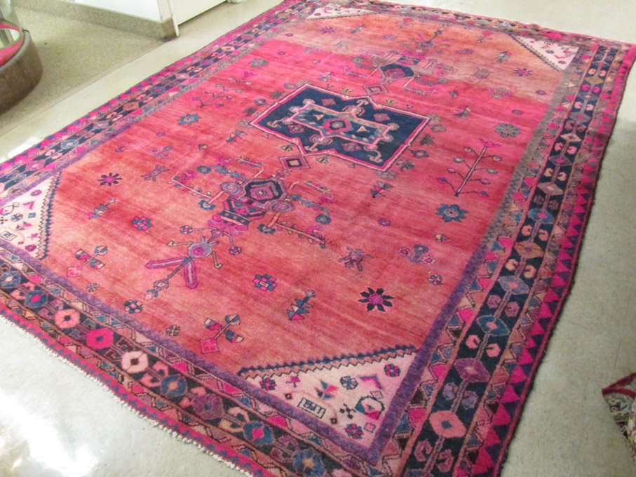 Appraisal: SEMI-ANTIQUE PERSIAN TRIBAL CARPET central geometric medallion and surrounding stylized