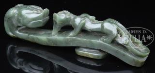 Appraisal: SPINACH GREEN JADEITE BELT HOOK th century China The large