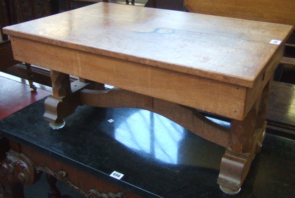 Appraisal: A Cotswold school low oak occasional table the two plank