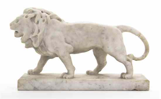 Appraisal: A Carved Marble Figure depicting a striding lion set on