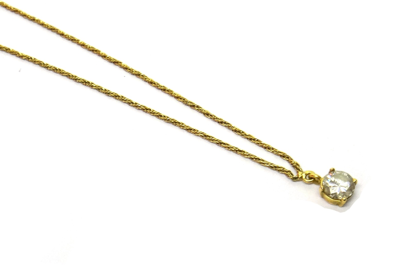 Appraisal: A gold and diamond set single stone pendant necklace claw