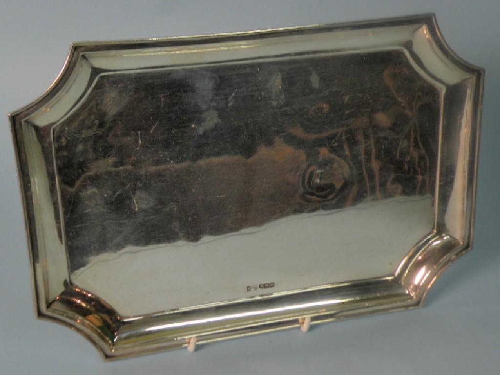 Appraisal: A canted rectangular silver tray with a raised border Sheffield