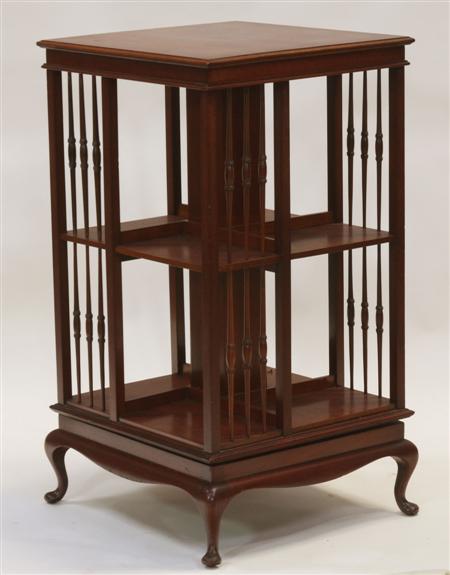 Appraisal: An Edwardian mahogany revolving bookcase the moulded square top over