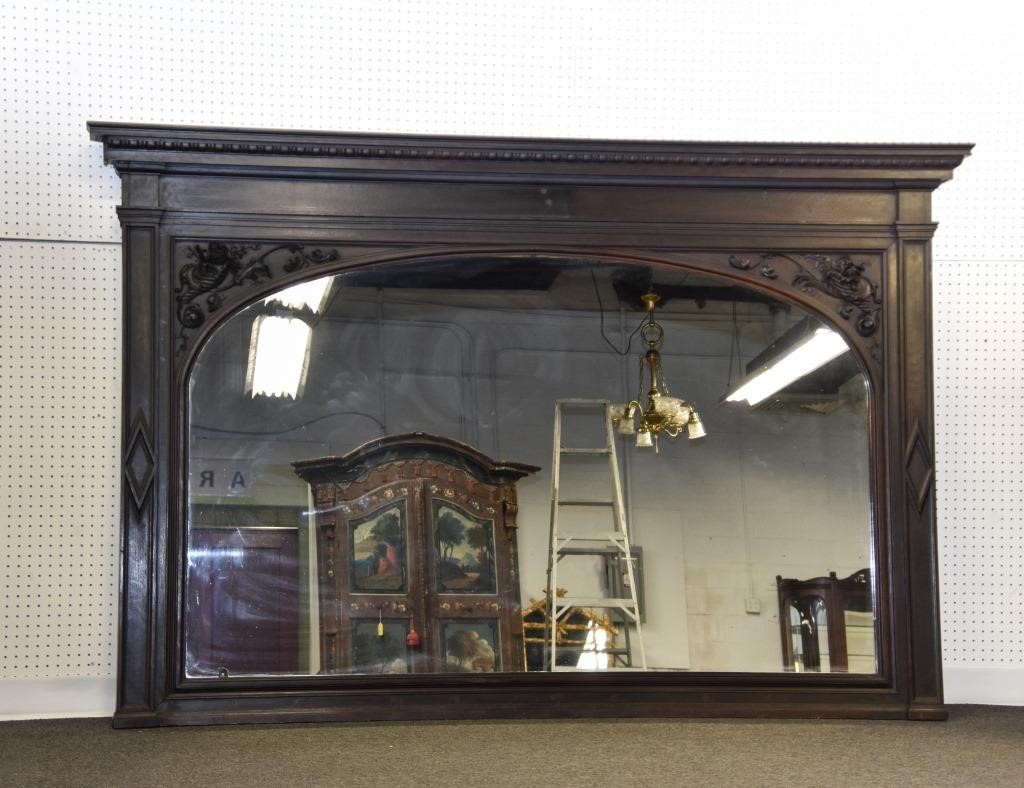 Appraisal: Carved oak mirrored bar back with egg and dart cornice