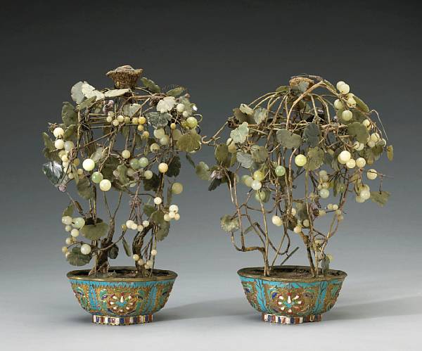 Appraisal: A pair of hardstone 'jewel' trees in enameled metal bases