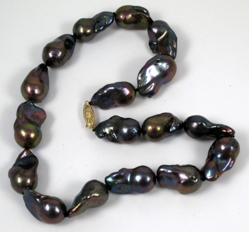 Appraisal: FRESHWATER BAROQUE PEARL NECKLACE strung with black peacock baroque pearls