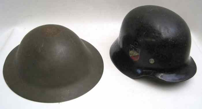 Appraisal: LOT OF TWO MILITARY HELMETS German WW Nazi type with