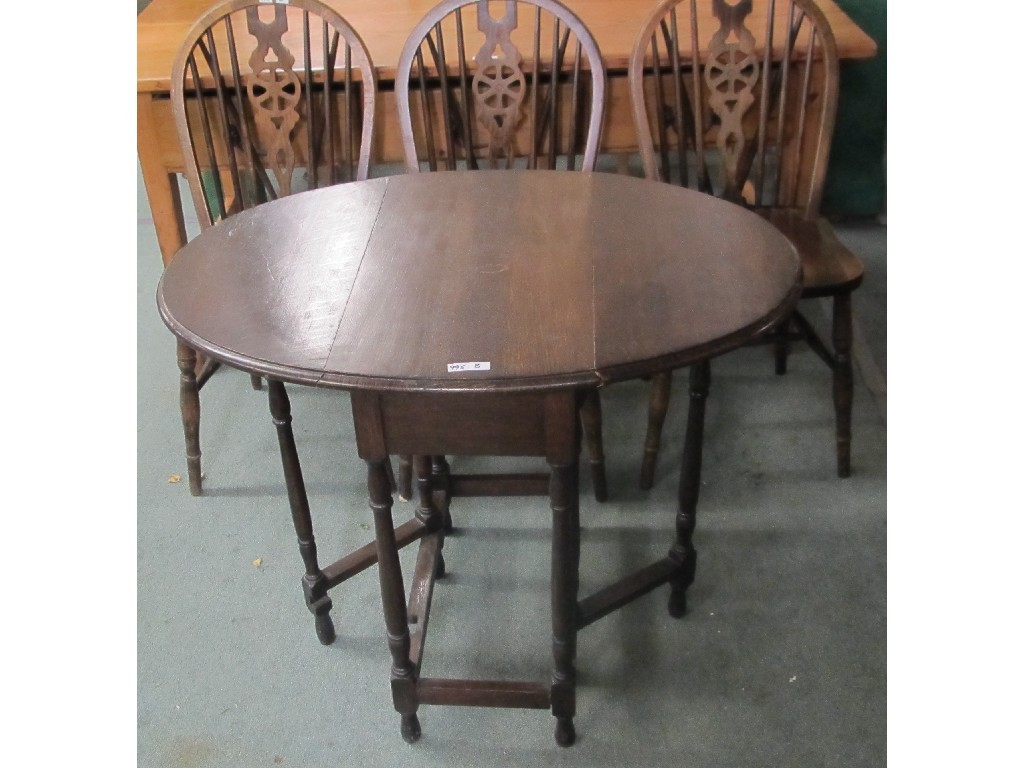 Appraisal: Oak drop leaf table four spindle back chairs and floor