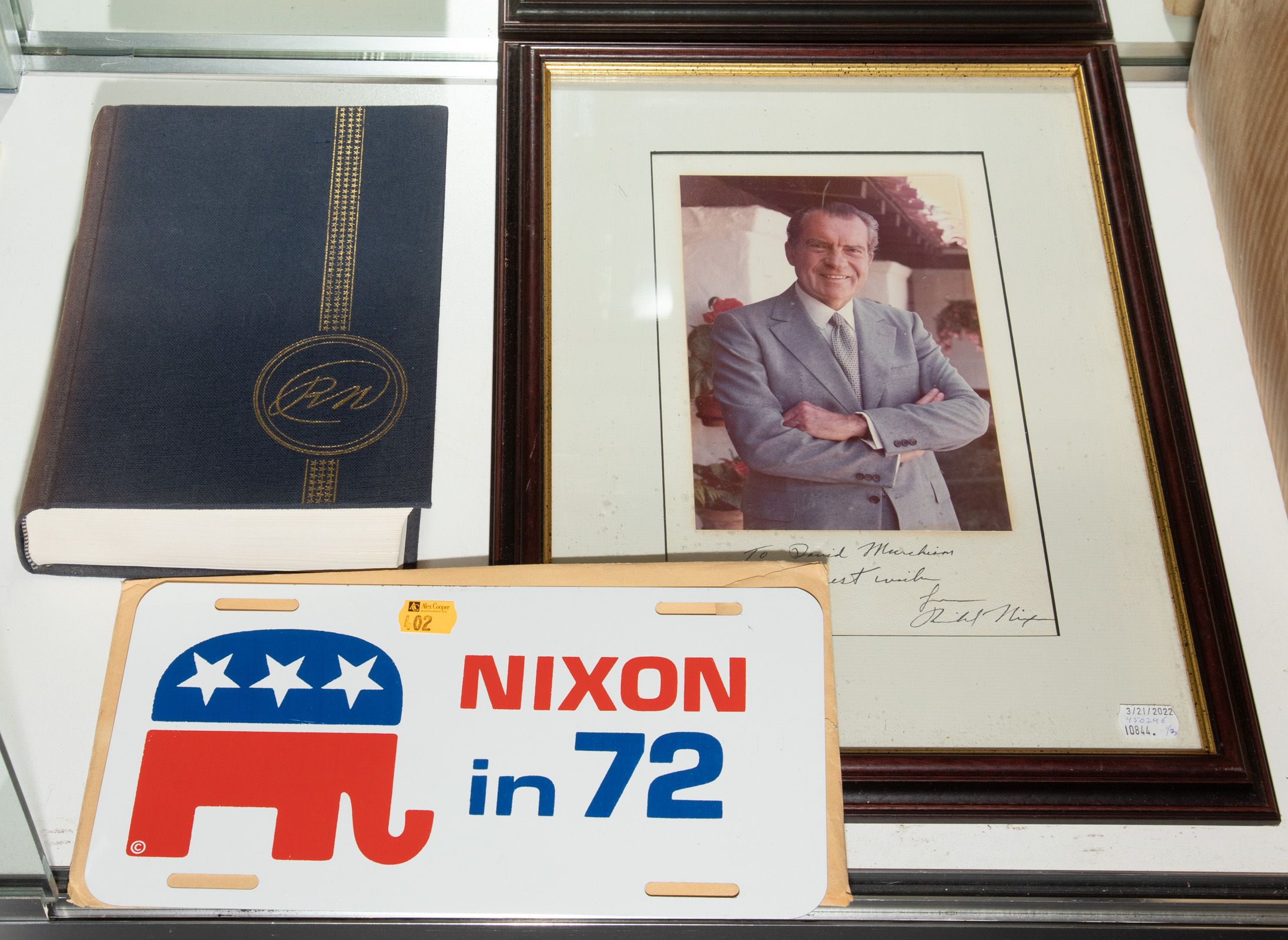 Appraisal: TWO RICHARD NIXON SIGNED ITEMS Comprising a color photograph portrait