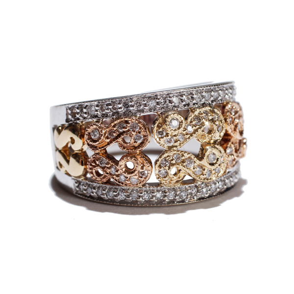 Appraisal: Ladies k three-tone gold scroll motif diamond band size