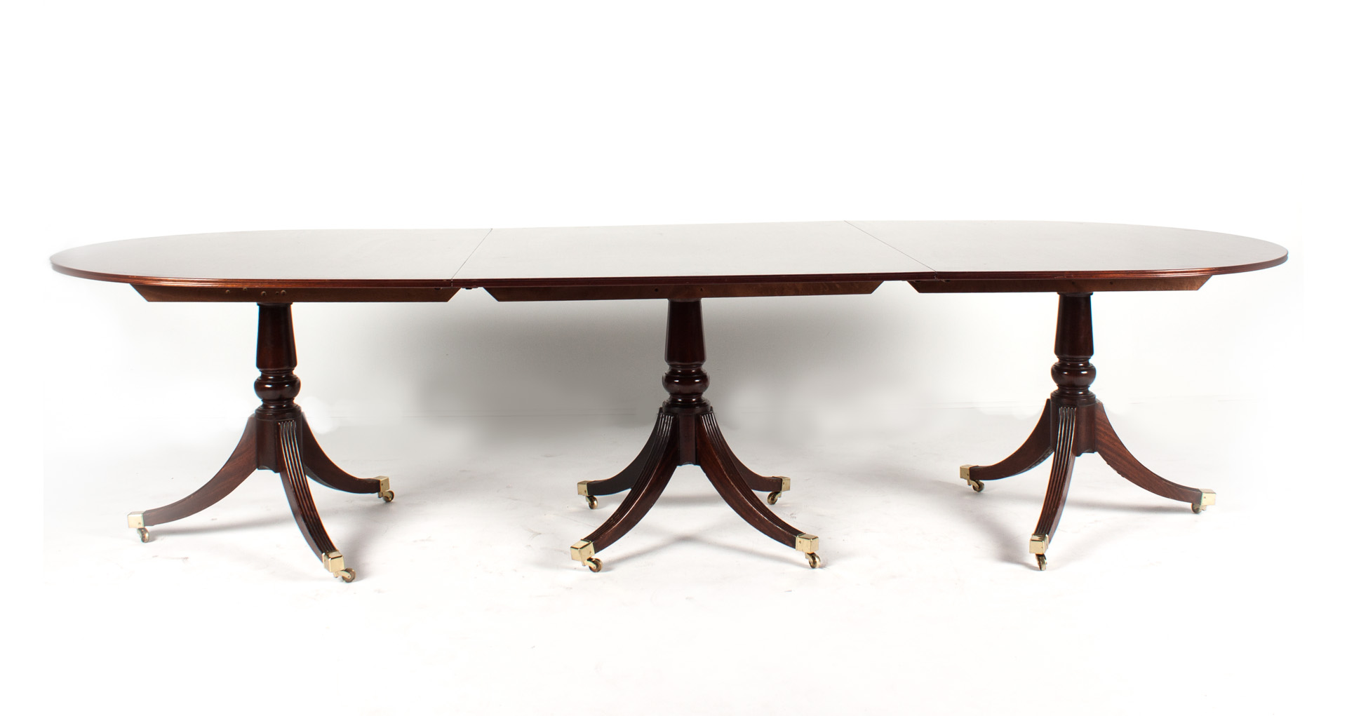 Appraisal: Federal style mahogany three-part banquet table triple pedestal comprising center