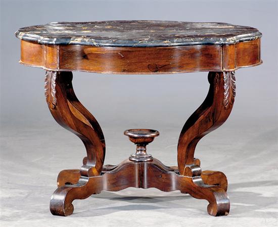 Appraisal: Victorian carved walnut and marble turtletop center table mid th