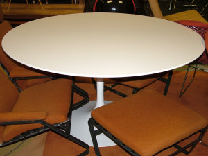 Appraisal: Eero Saarinen a 'Tulip' pedestal group dining table designed by