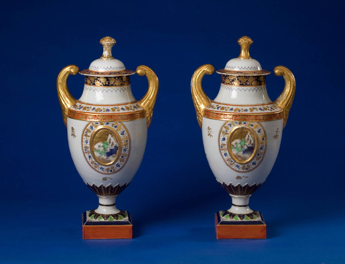 Appraisal: PAIR OF CHINESE EXPORT PORCELAIN PISTOL-HANDLED URNS AND COVERS CIRCA