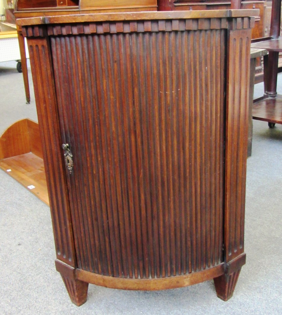 Appraisal: A th century Dutch mahogany tambour fronted floor standing corner