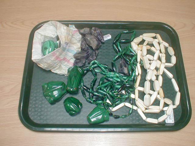 Appraisal: Four malachite necklaces assorted unmounted pendants frogs etc Three ivory