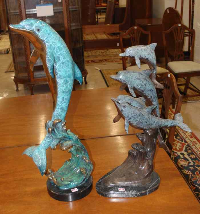 Appraisal: TWO BRONZE MARINE WILDLIFE SCULPTURES a single jumping dolphin and