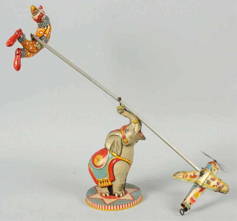 Appraisal: Tin Litho Unique Art Flying Circus Wind-Up Toy American Working