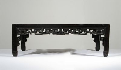 Appraisal: A Chinese hardwood rectangular low table or stand with a