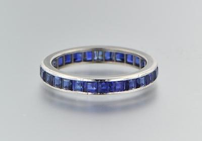 Appraisal: A Platinum and Sapphire Eternity Ring Channel set square cut