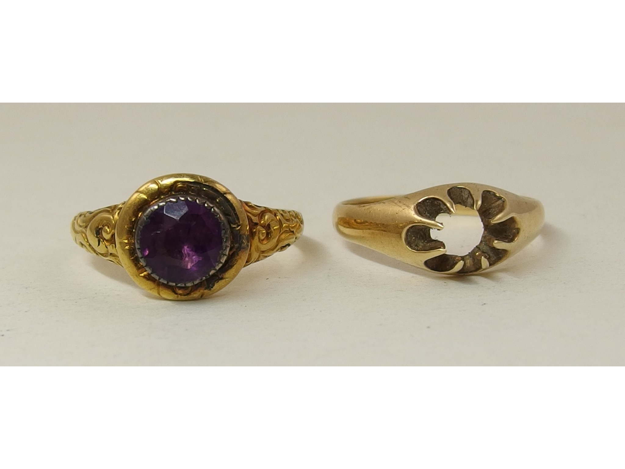 Appraisal: A yellow metal gem set ring together with a ct