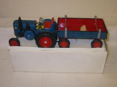 Appraisal: A German tin plate tractor and trailer clockwork powered steering