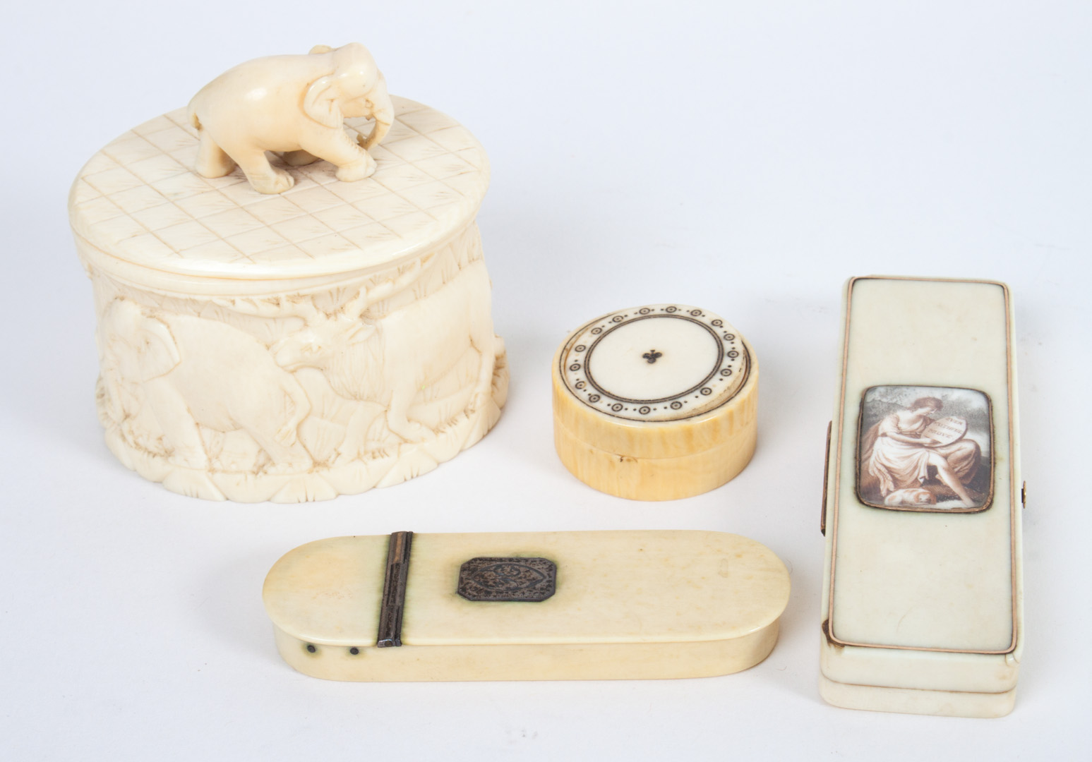 Appraisal: Four European and African carved ivory boxes African carved ivory