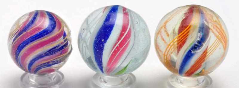 Appraisal: Lot of Solid Core Swirl Marbles Description The smaller marble