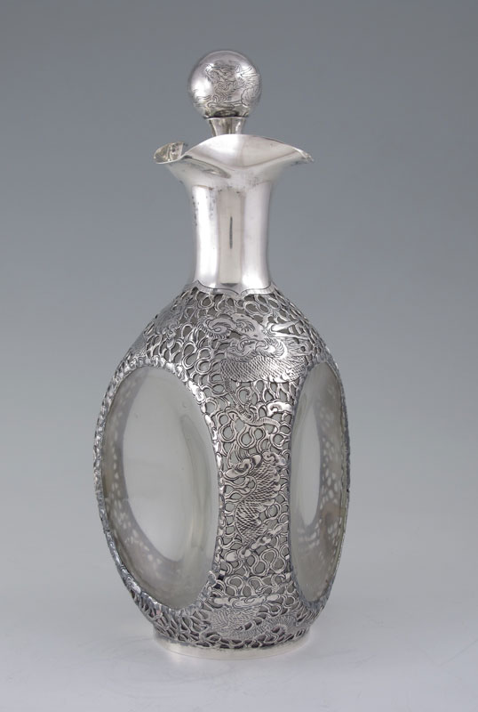 Appraisal: ORIENTAL DRAGON MOTIF SILVER OVERLAY DECANTER Clear glass with filigree