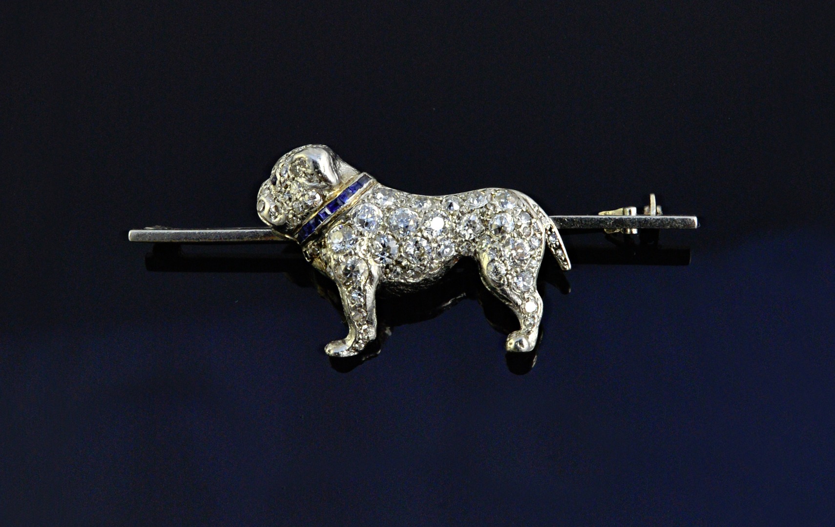 Appraisal: A diamond and sapphire set brooch designed as a standing