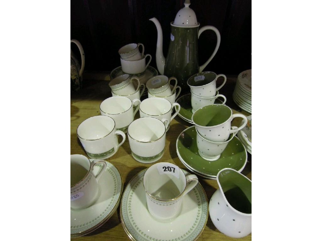 Appraisal: A collection of Susie Cooper coffee wares with olive green