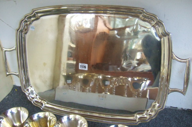 Appraisal: A plated shaped rectangular twin handled tray with a stylized