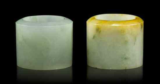 Appraisal: A Pair of Chinese Jadeite Archer's Rings of white and