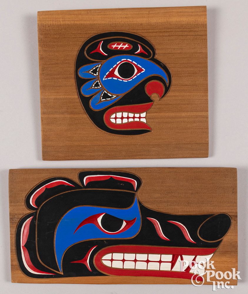 Appraisal: Four Northwest Coast painted wall plaques Four Northwest Coast painted