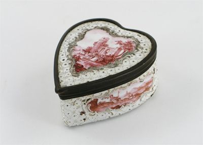 Appraisal: An enamel heart-shaped box with metal mounted hinged lid painted