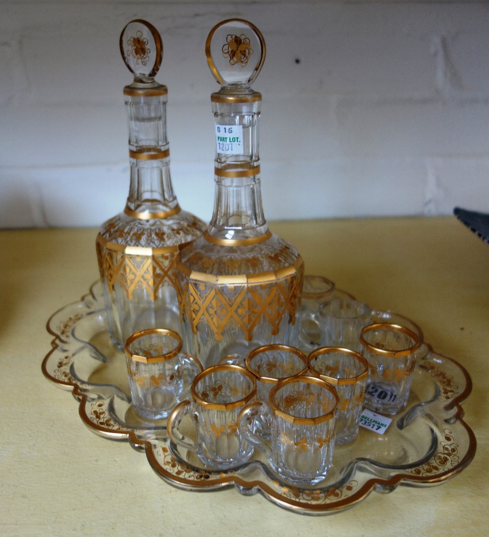 Appraisal: A pair of gilt glass decanters and stoppers th century