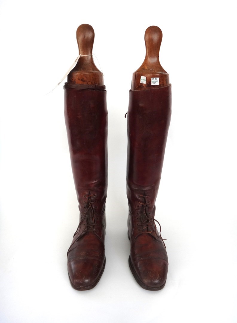 Appraisal: A pair of brown leather riding boots with wooden trees