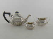 Appraisal: A silver three piece bachelor's teaset of oval half ribbed