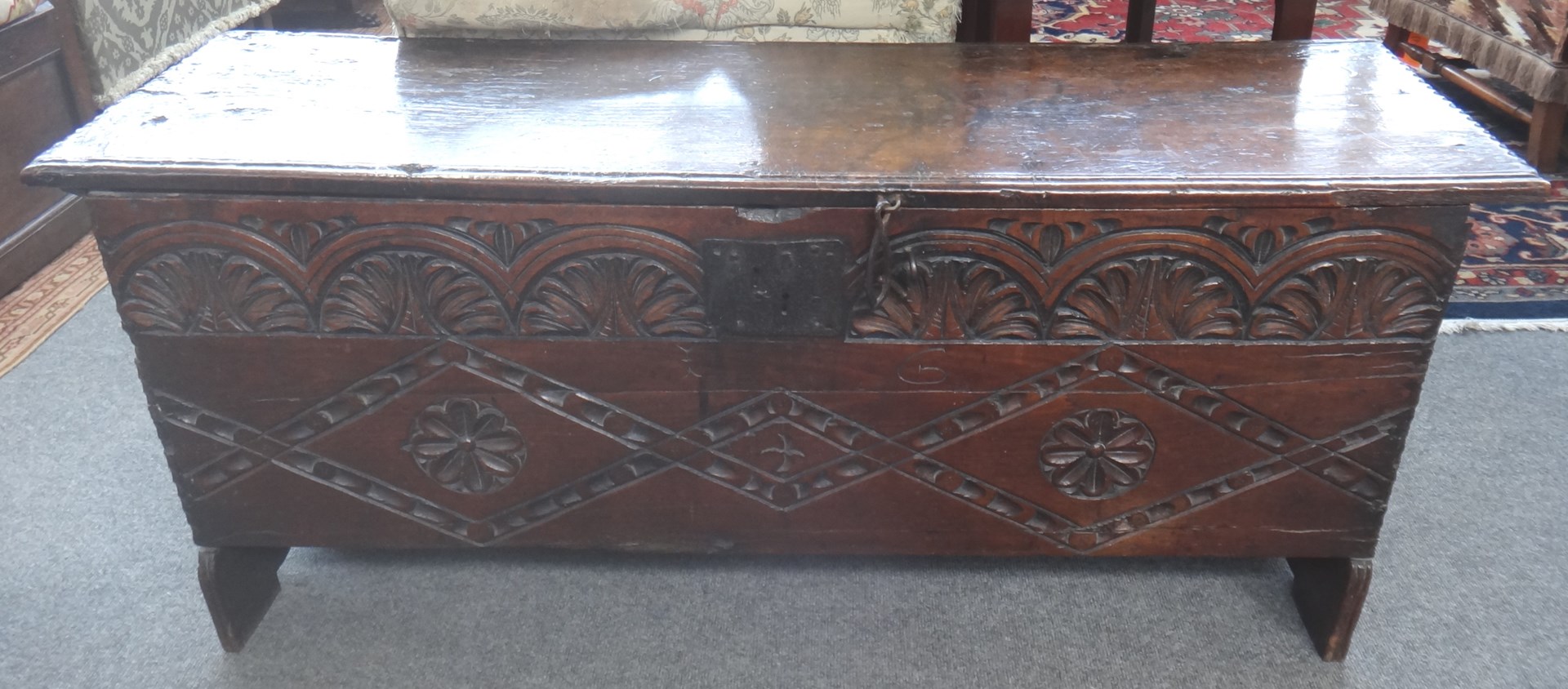 Appraisal: A Charles II carved oak five plank coffer on slab